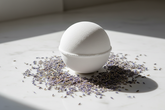 white bath  bomb with lavender buds around